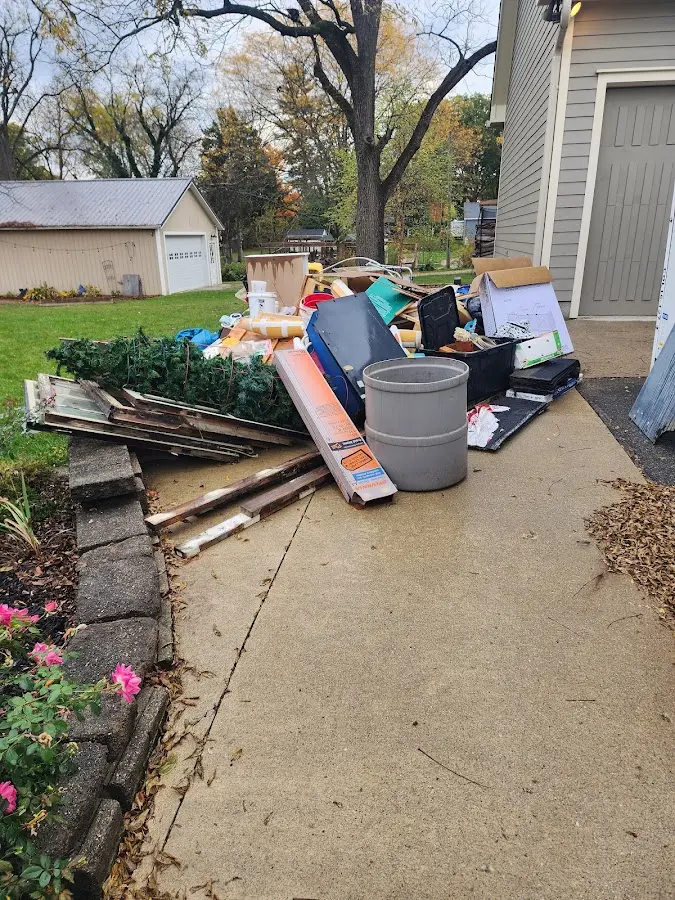 Dumpster being loaded with debris for Commercial Dumpster Rental in Germantown